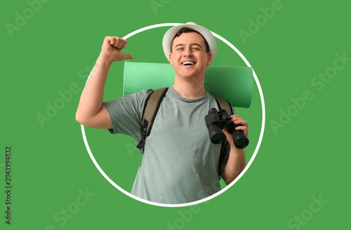 Young man with binoculars a...