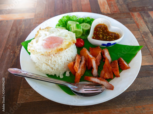 fried pork belly with rice and fried egg