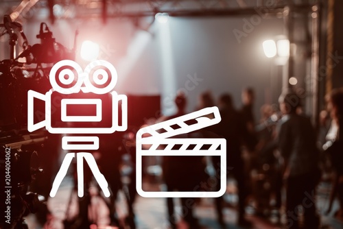 A busy film production set featuring cinema cameras and lighting rigs, capturing the essence of movie-making