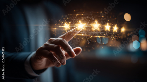 Hand of a businessman pointing at five glowing golden stars as a symbol of top quality service