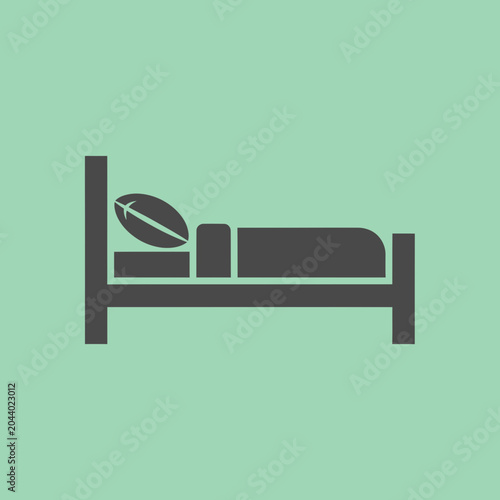 Simple Bed with Pillow and Football.