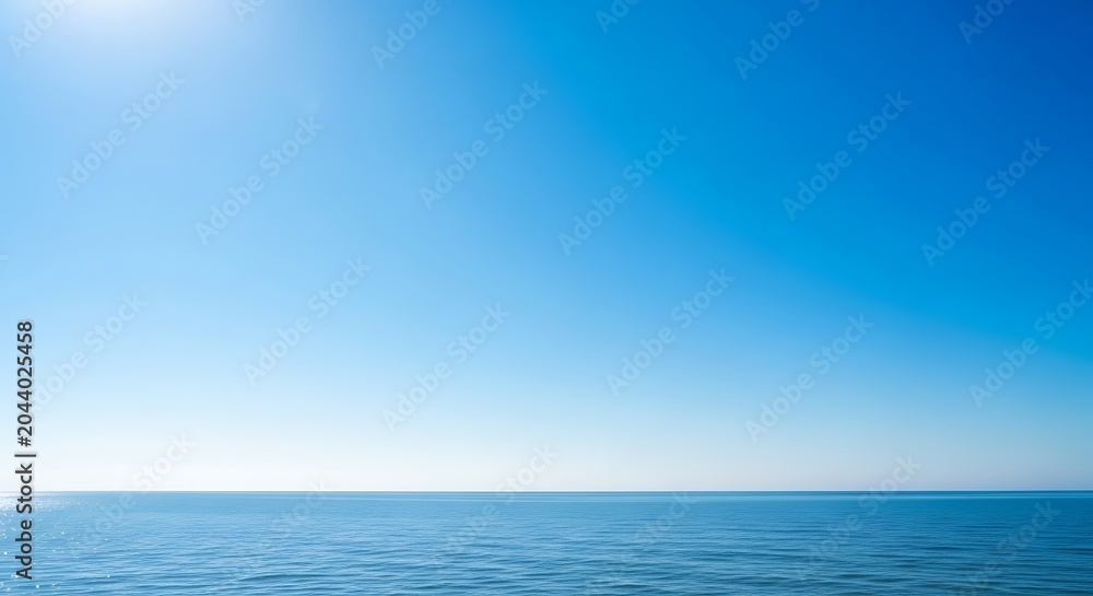 Fototapeta premium Tranquil Ocean Horizon Under Clear Blue Sky
