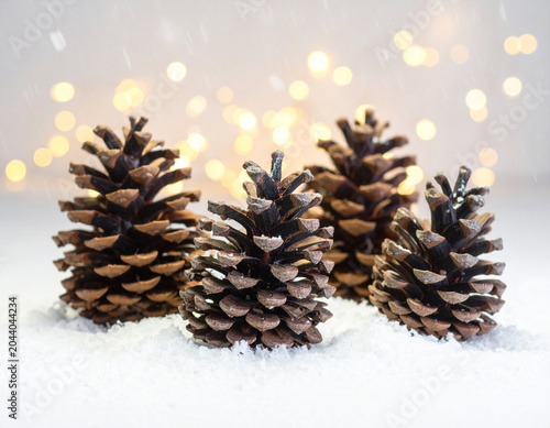 pinecones, fairy lights, snowfall effect, Generated image	
