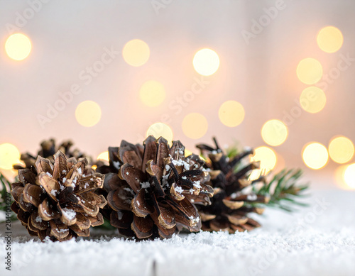 pinecones, fairy lights, snowfall effect, Generated image	
