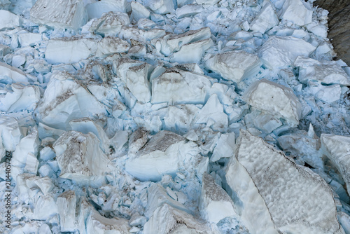 фотографія Close-Up of Broken Glacier Ice and Blue Snow Chunks on a BC, Canada Glacier Face