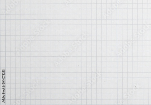 Closeup of a blank white graph paper sheet with blue grid lines