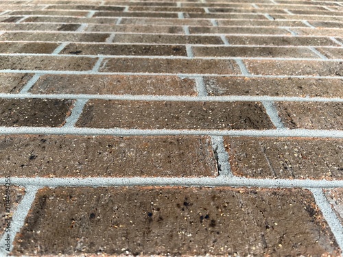 Low Angle View of Brown Brick Wall Looking Up with Perspective. Looking up view of a brick wall. Flat Perspective of Brownish Brick Wall Up side View.
