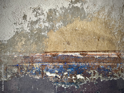 Abstract peeling paint wall texture with distressed colorful layers