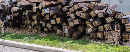 Used railway track ties sleepers beside a railway line