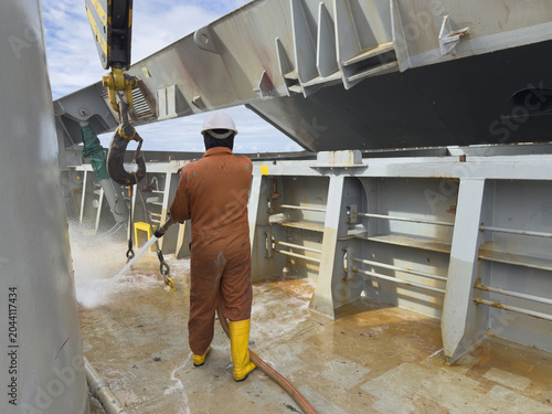 Obraz na plátne able seaman washing ship deck