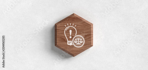 Photos A wooden hexagon with a light bulb and scales of justice icon representing legal