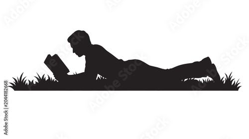 Photos Silhouette of a man lying on grass reading a book.