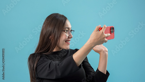 Bild auf Leinwand Attractive casual millennial girl capturing a self portrait using modern mobile