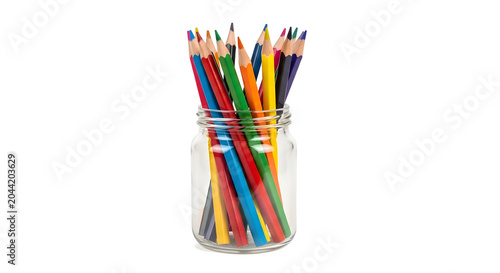 Colorful pencils in a clear glass jar