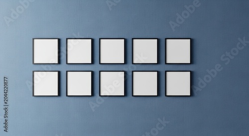 Ten blank square photo frames arranged in a grid on blue wall with photography, interior