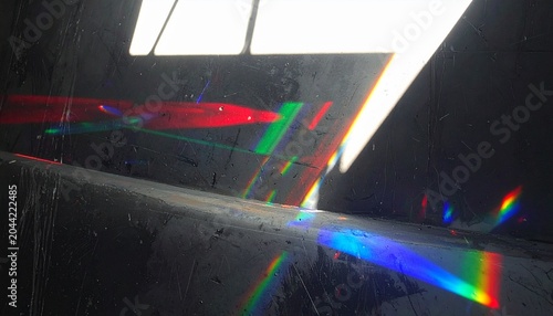 Abstract prism‑like light dispersion with bright white source refracted into red, green, and blue spectrum across 
