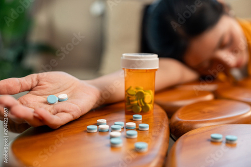 Tableau sur toile The woman was experiencing stress and depression and took pills to commit suicide