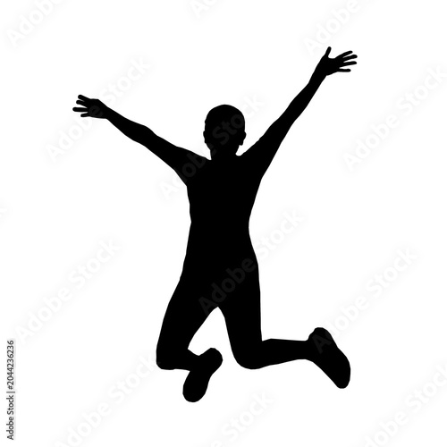Bild auf Leinwand A silhouette of a person jumping with arms outstretched in joy and excitement