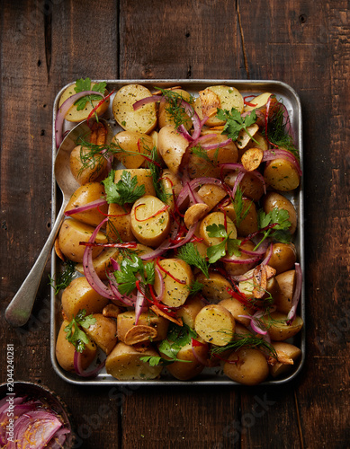 Healthy Homemade Potato Salad with Fresh Herbs on Rustic Wooden Table
