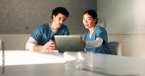 Nurse, discussion and team with laptop in clinic, administration and reading medical records on web. Healthcare specialist, online and people with tech for test results, info and research in hospital