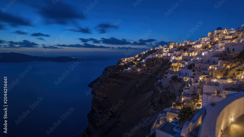 Obraz premium Santorini Island Coastal Architecture at Night Travel Destination Banner