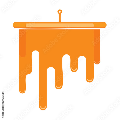 Orange honey dripping from a container