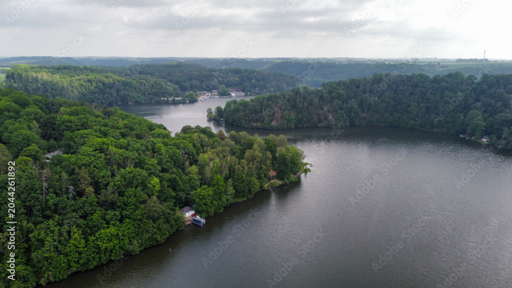Fototapeta premium Aerial View over the Kriebstein Nature Reserve, the dam, in Saxony, Germany.