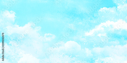 Foto Soft white clouds in a serene light blue sky with a textured effect for a vintag