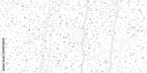 Foto Abstract rain drops falling on a glass window surface in a rainy day