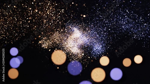 Abstract blue and gold bokeh lights with glitter background
