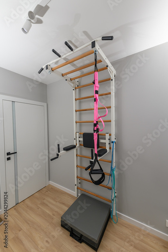 Pull-up bar installed at home, private gym for stretching, weight training and gymnastics