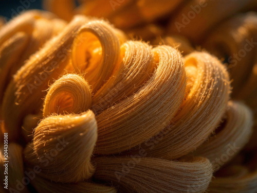 Freshly baked golden croissants stacked in warm morning light with soft texture