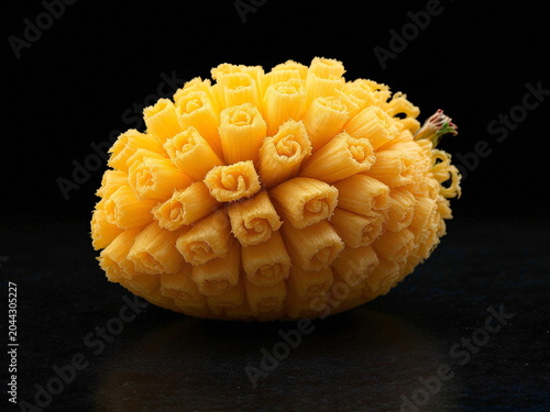 Freshly baked golden bread loaf with crusty texture on dark background