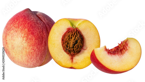Whole and sliced ripe peaches with visible pit and red blush skin