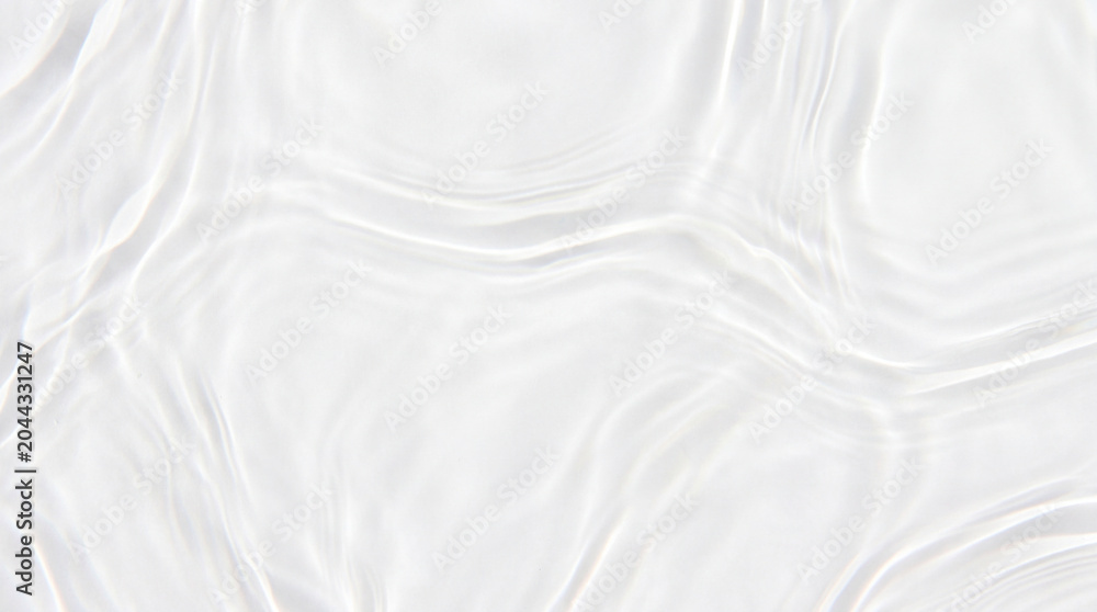 Obraz premium Pure white water ripple texture with soft light caustics and smooth liquid waves for premium cosmetic mockup backdrop