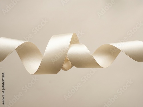 Elegant Cream Satin Ribbon Twist on Soft Neutral Background Minimalist Style