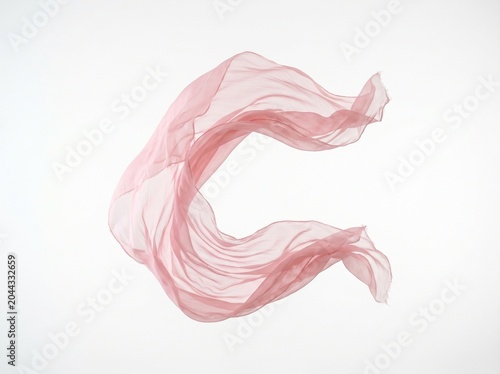 Elegant pink silk scarf floating in soft light minimalist abstract composition