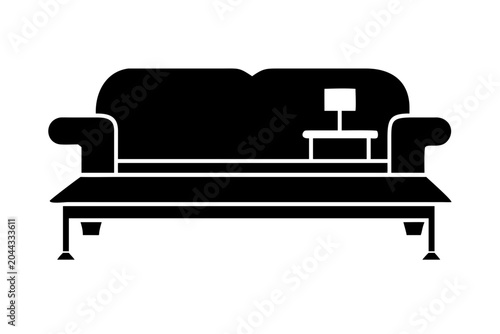 Sofa with a lamp on a side table icon