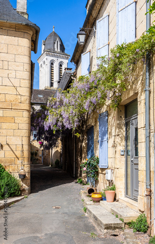 Old townhouses in the rue du Marteau in the historic center of Montignac, France, the village in the Vézère valley where the Lascaux cave is located, on a sunny spring day.