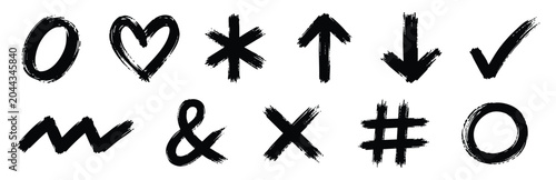 Foto Collection of hand drawn brush stroke symbols including heart, arrows, check mark, ampersand, cross, and hashtag isolated on white background
