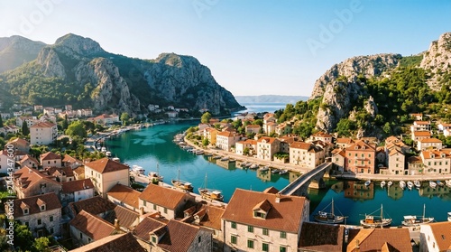 Ultra high resolution panoramic view of Omis old town with orange terracotta roofs, Cetina river and deep limestone canyon mountains, Dalmatia, Croatia