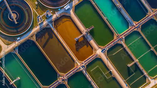 Photos Aerial view of a wastewater treatment plant with colorful rectangular sedimentat