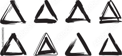 Collection of eight black abstract brush stroke triangles