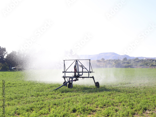 Modern Irrigation Equipment Over Expansive Farm Fields