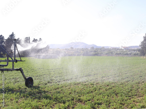 Irrigation System Spraying Water Across Field