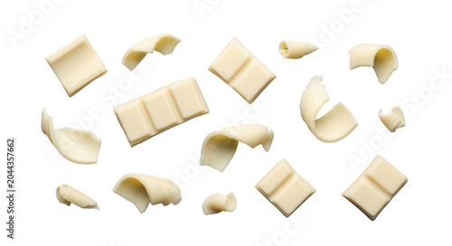 Set of white chocolate pieces and curls isolated on transparent background