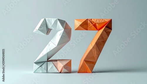 The 3D origami numbers twenty-seven are displayed prominently on a plain surface indoors.