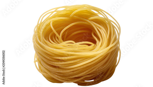 Bild auf Leinwand Nest of raw spaghetti pasta, uncooked durum wheat noodles