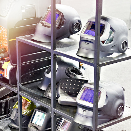 Auto Darkening Welding Helmets Displayed on Workshop Shelf