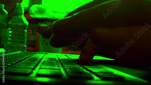 Timelapse.Cinematic macro of fast typing on a computer keyboard. Defocused background, low light. Visualizes overnight work, strict deadline, copywriting, content creation and productivity.